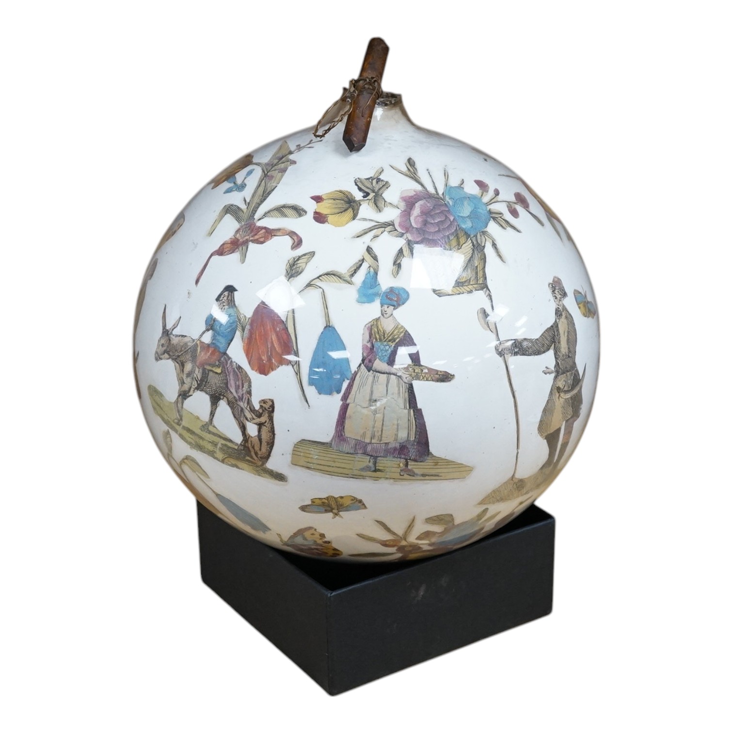 An inside decorated glass witch’s ball, 17cm in diameter. Condition - fair